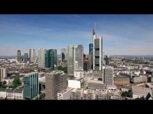 Scanclimber SC8000 mast climber cladding the 148 m Eurotower skyscraper in Frankfurt, Germany